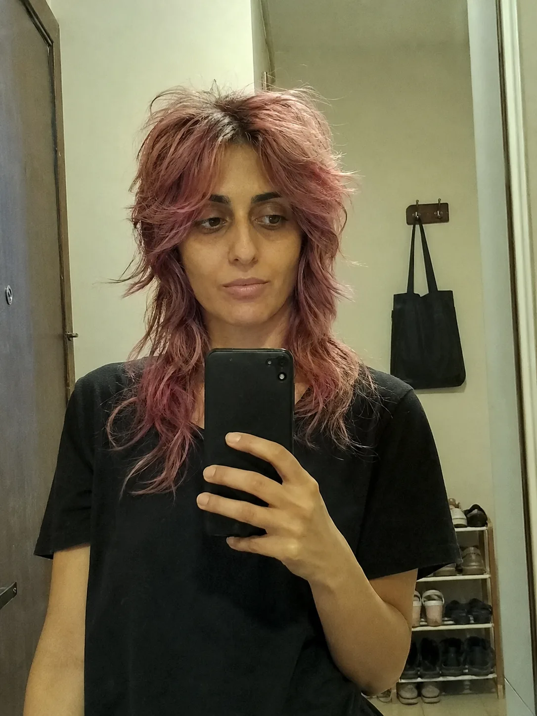 Strawberry pink layered haircut with face-framing pieces