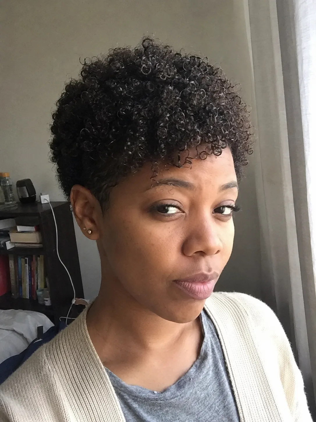 Short curly pixie cut with defined ringlets for black hair