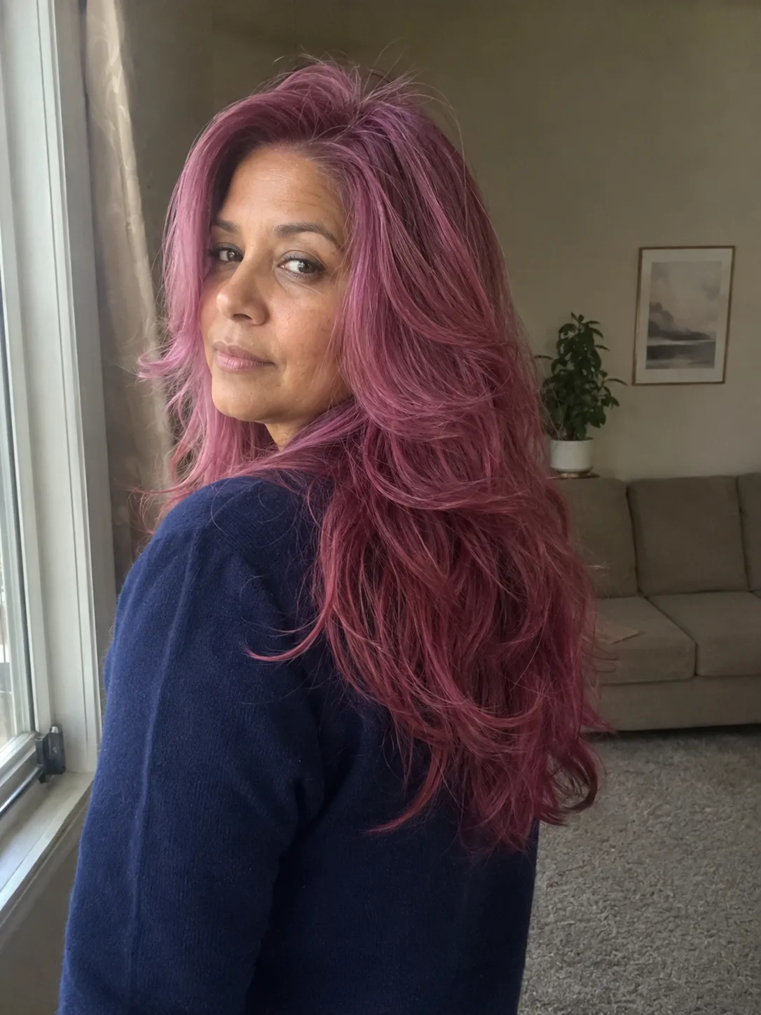Pastel pink bob haircut with soft waves and side part