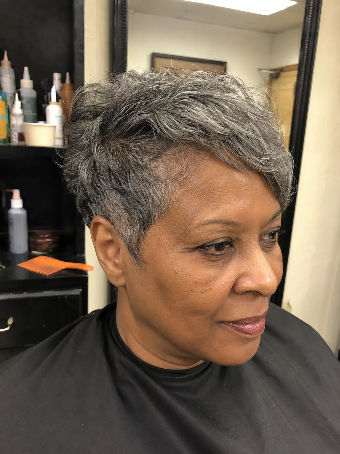 Copper hair color with caramel copper blend and medium layered waves for everyday style