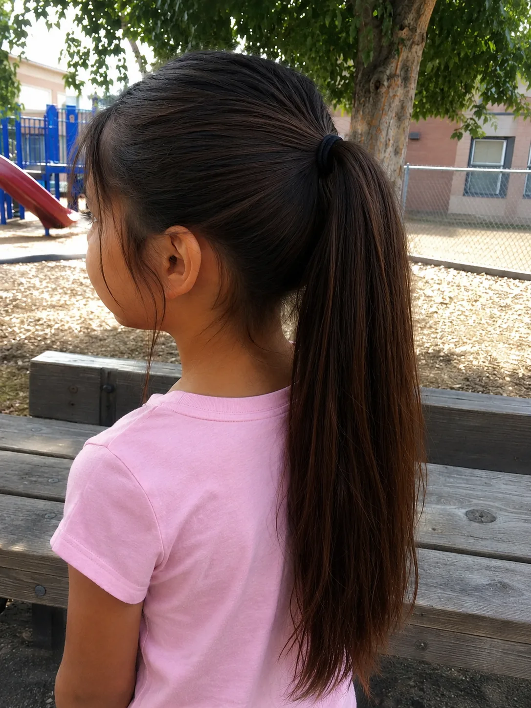 A beautiful hairstyle for little kids showcasing healthy length and clean perimeter management.
