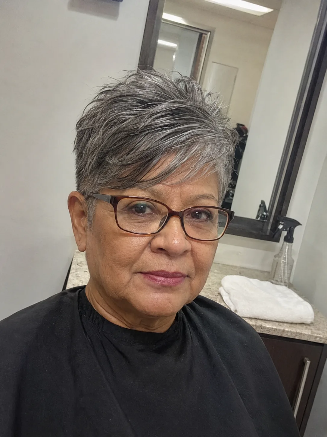 Shoulder-length brunette layers with soft face-framing highlights