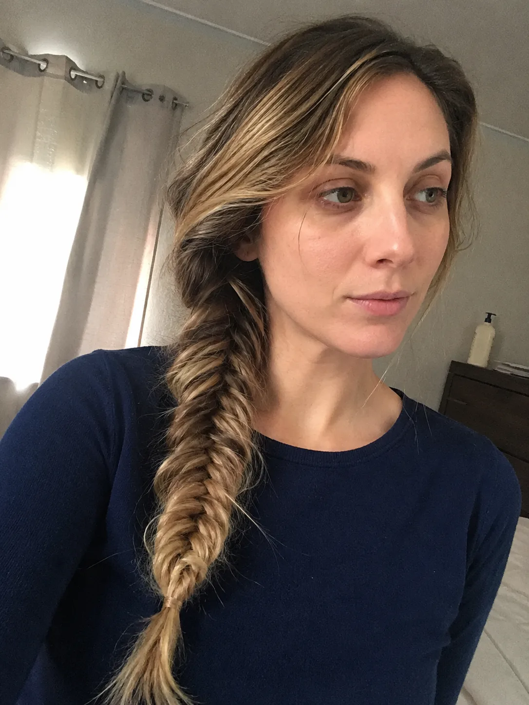 A complex woven crown braid showing an advanced level of underneath support and hair pinning