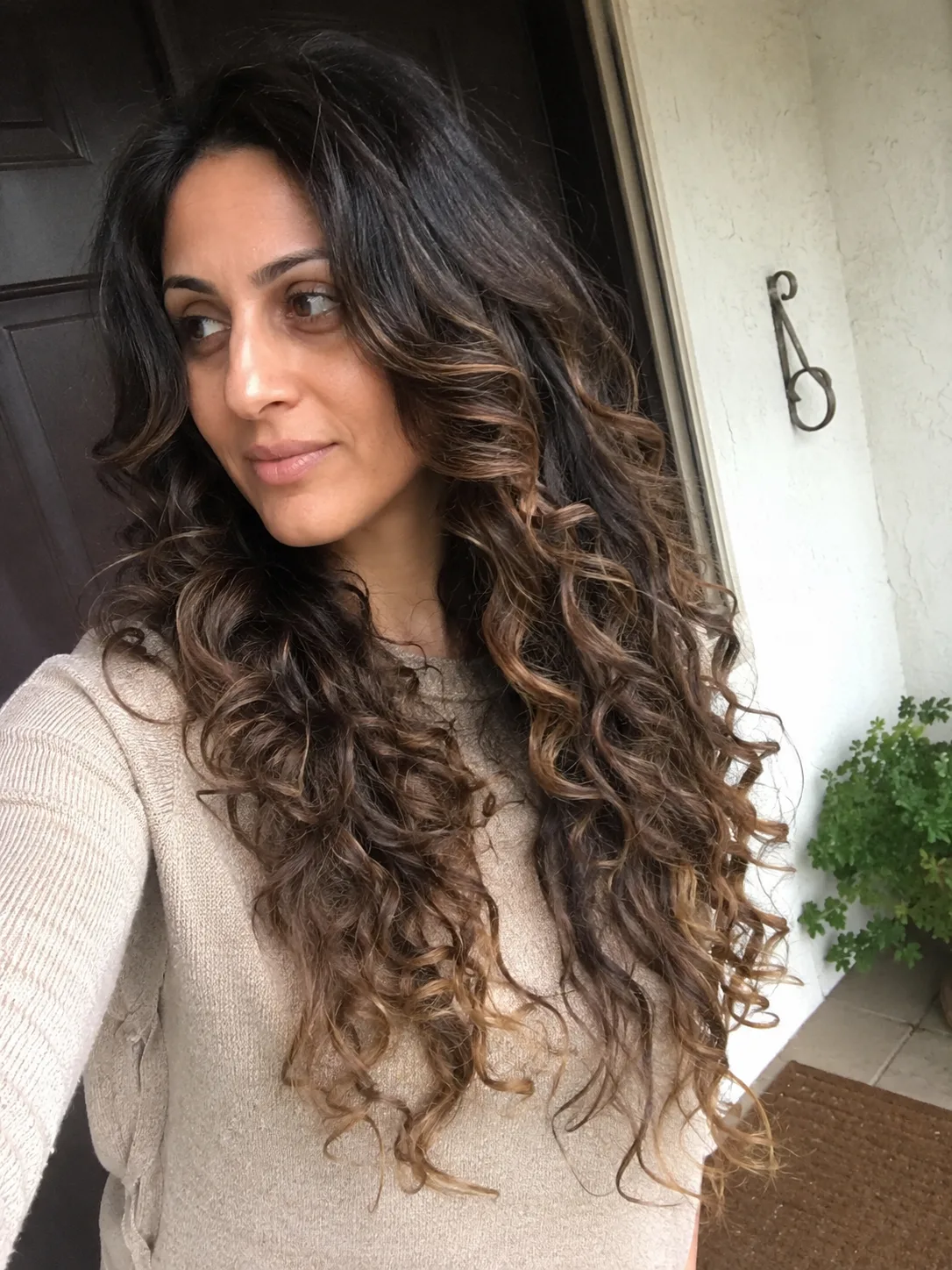 A curly hairstyle with highly defined, separated clumps, showing the result of proper diffusing