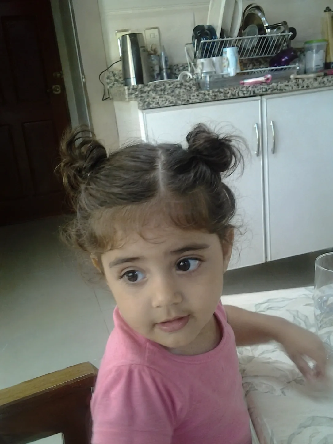 A cute short toddler haircut customized for a clean and manageable daily look