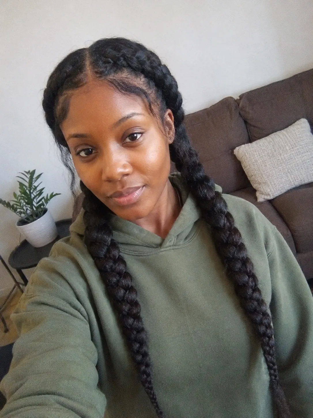 A side profile of a sleek, closer-to-the-head French braid style ideal for finer hair textures