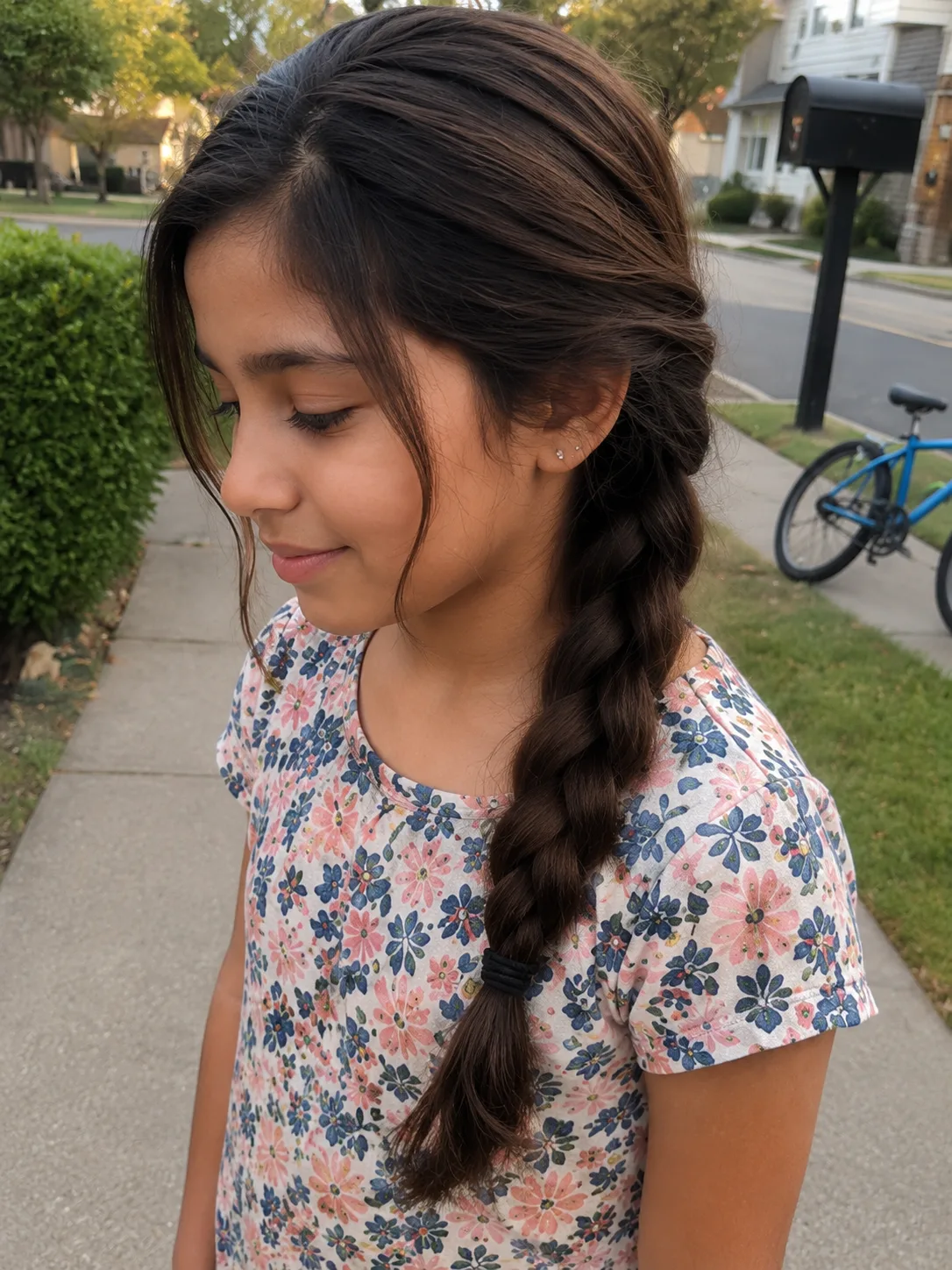 A simple kid ponytail configured using soft, structural layering techniques