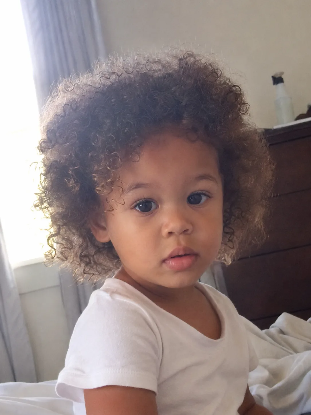 A structured short hairstyle keeping appropriate length through the toddler's crown