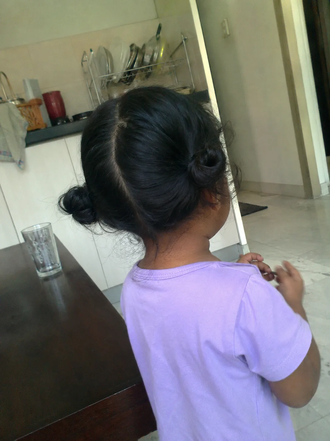 A visible natural shift from straight baby strands to a defined toddler wave pattern