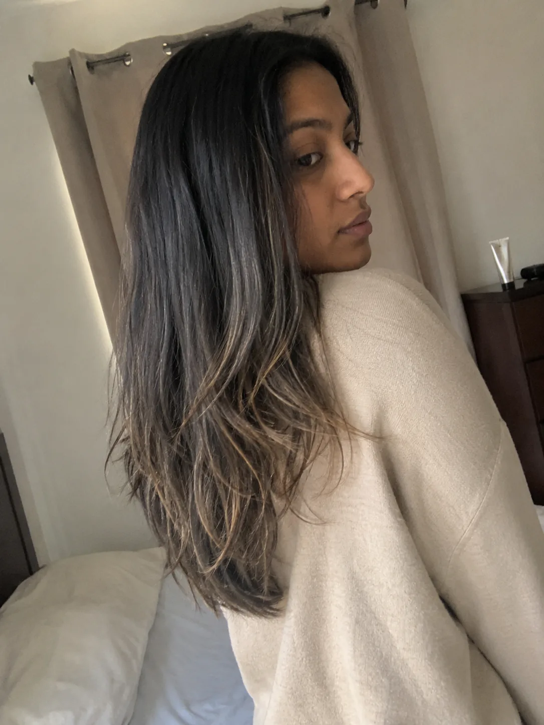 Long straight brunette hair with side-swept face-framing layers