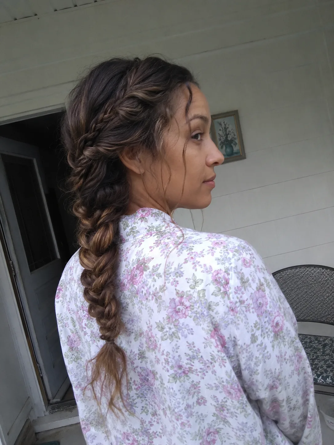 An extra-long, dense triple-strand braid cascading down the back, showcasing heavy hair volume