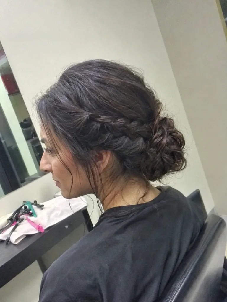 Authentic middle ages braided crown updo featuring symmetric historical plait work and a clean center part.