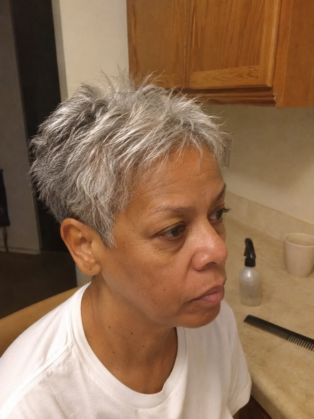 Beautifully soft silver highlights seamlessly blended near the parting of a mature client