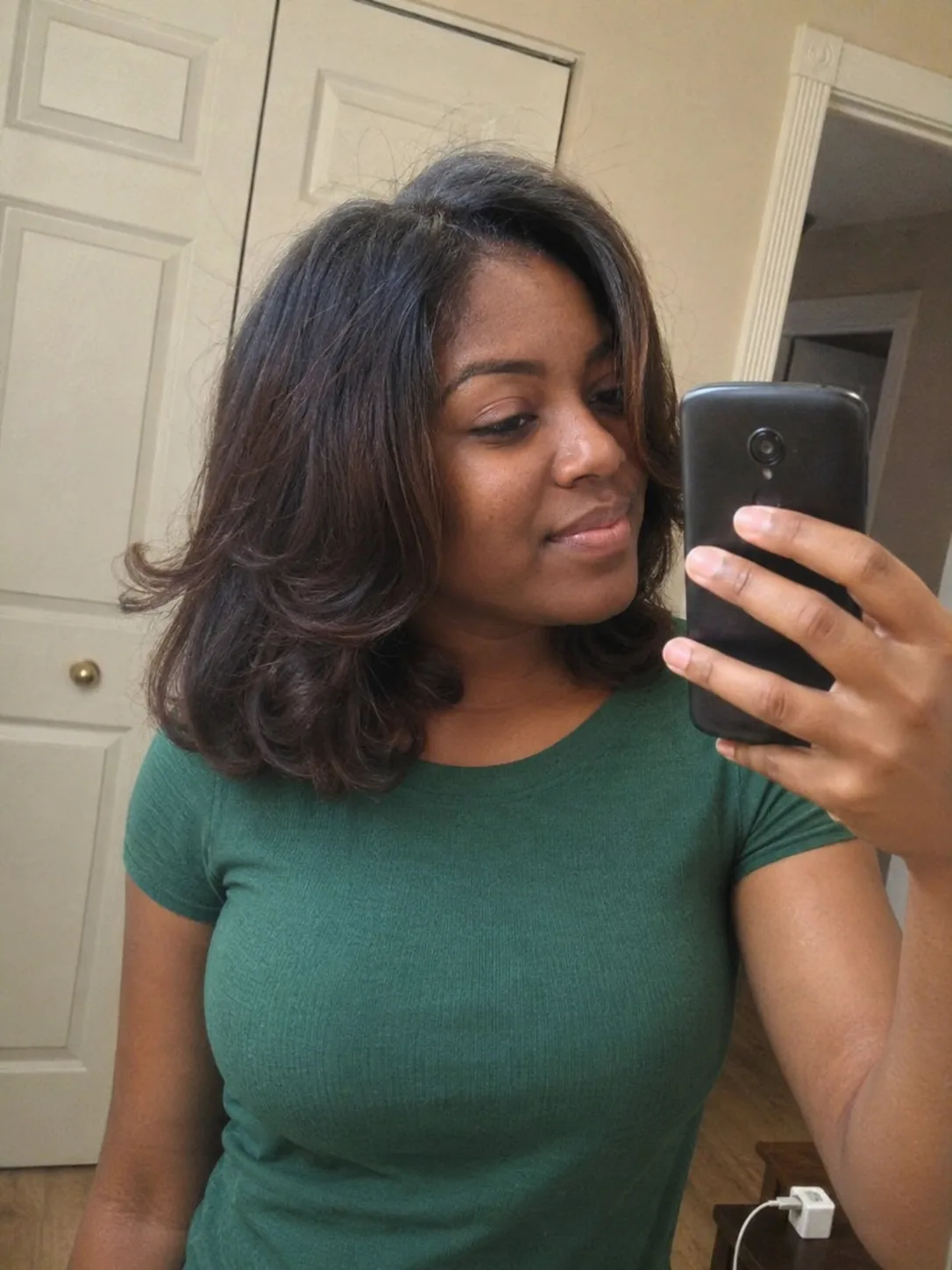 Blowout hairstyle with soft wispy bangs and layered face framing pieces