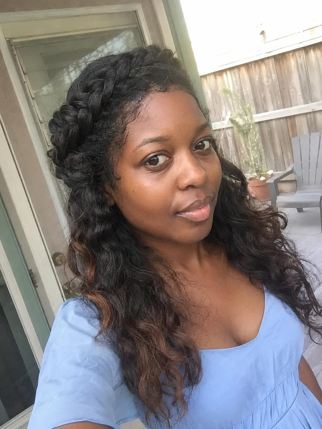 Braided crown graduation style with loose curls