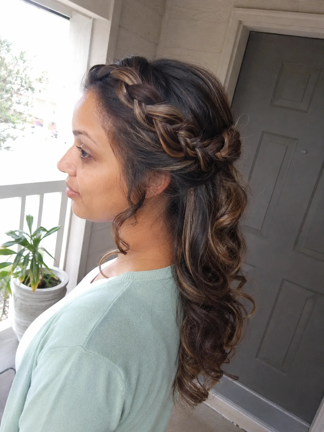 Bridesmaid hairstyles half up half down with curly texture and ribbon braid detail