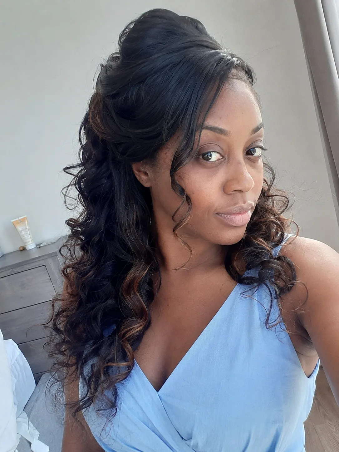 Bridesmaid hairstyles half up half down with lifted crown and defined curls