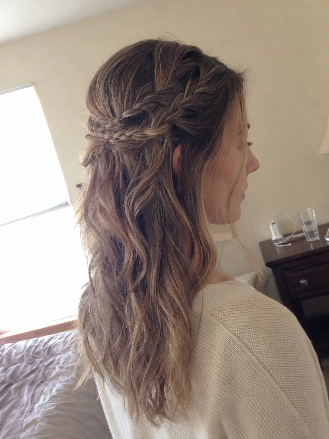 Bridesmaid hairstyles half up half down with twisted crown and loose highlighted waves