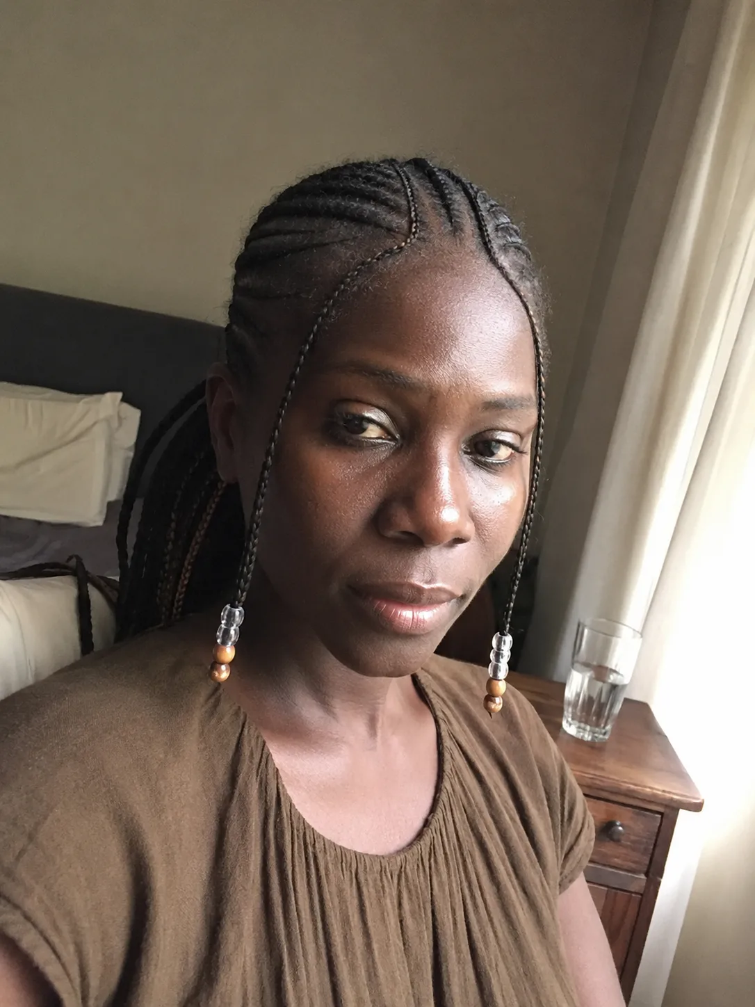 Close up of a secure double wrapped elastic base holding a heavy extended braided ponytail