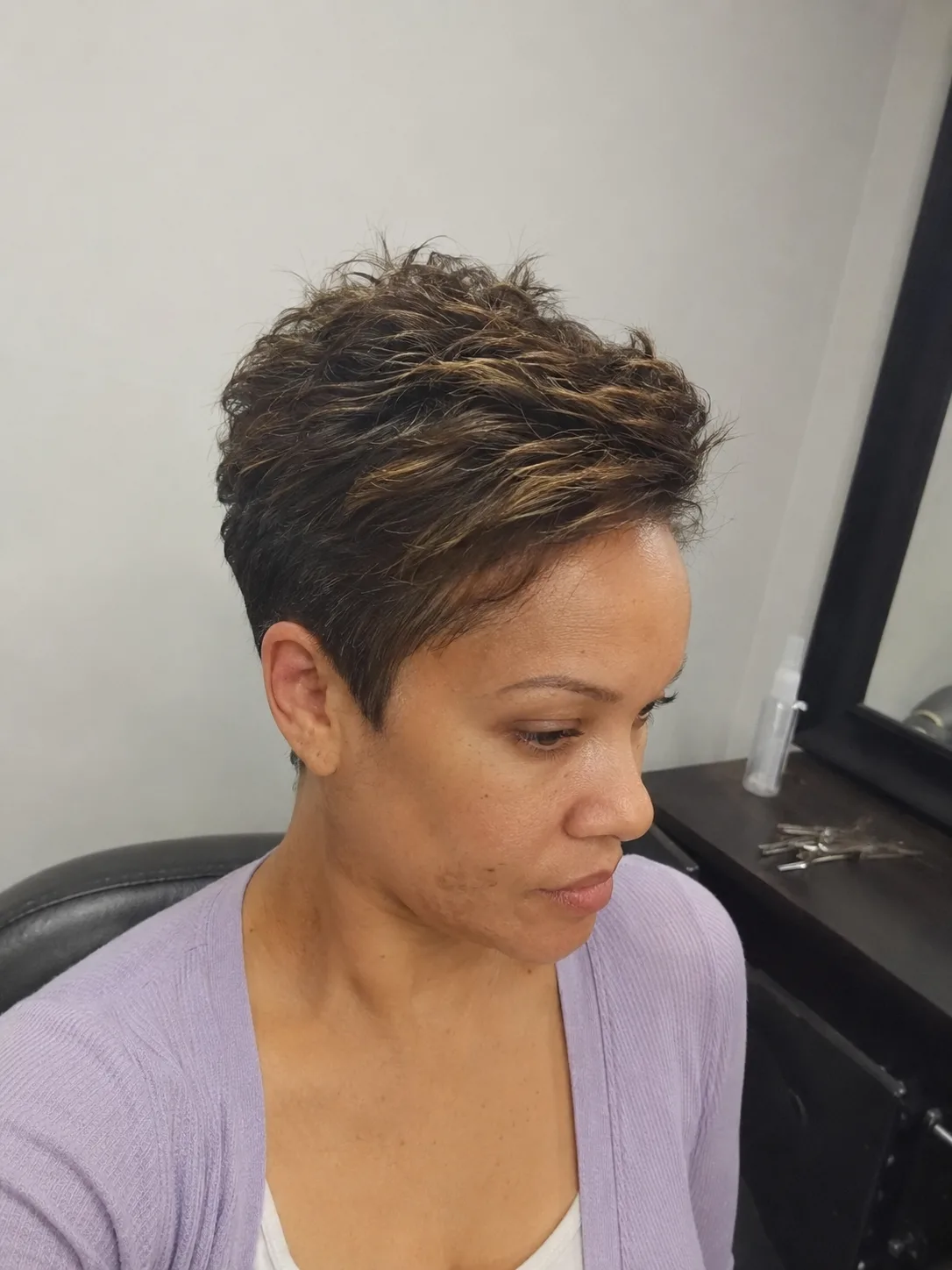 Side-parted short pixie with soft crown volume for a bridal look