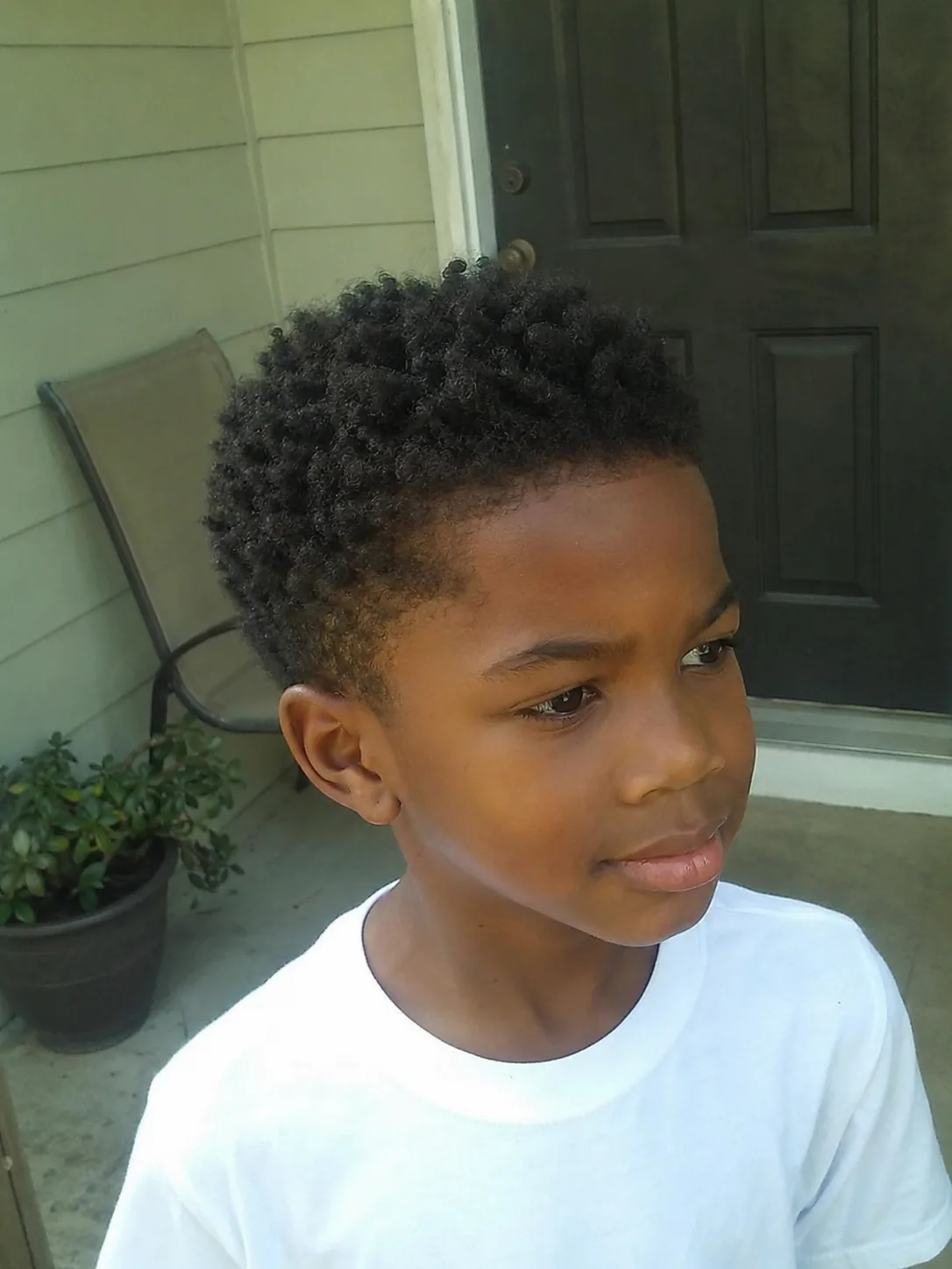 Coarse straight hair on a kid cut short with interior thinning for lightness