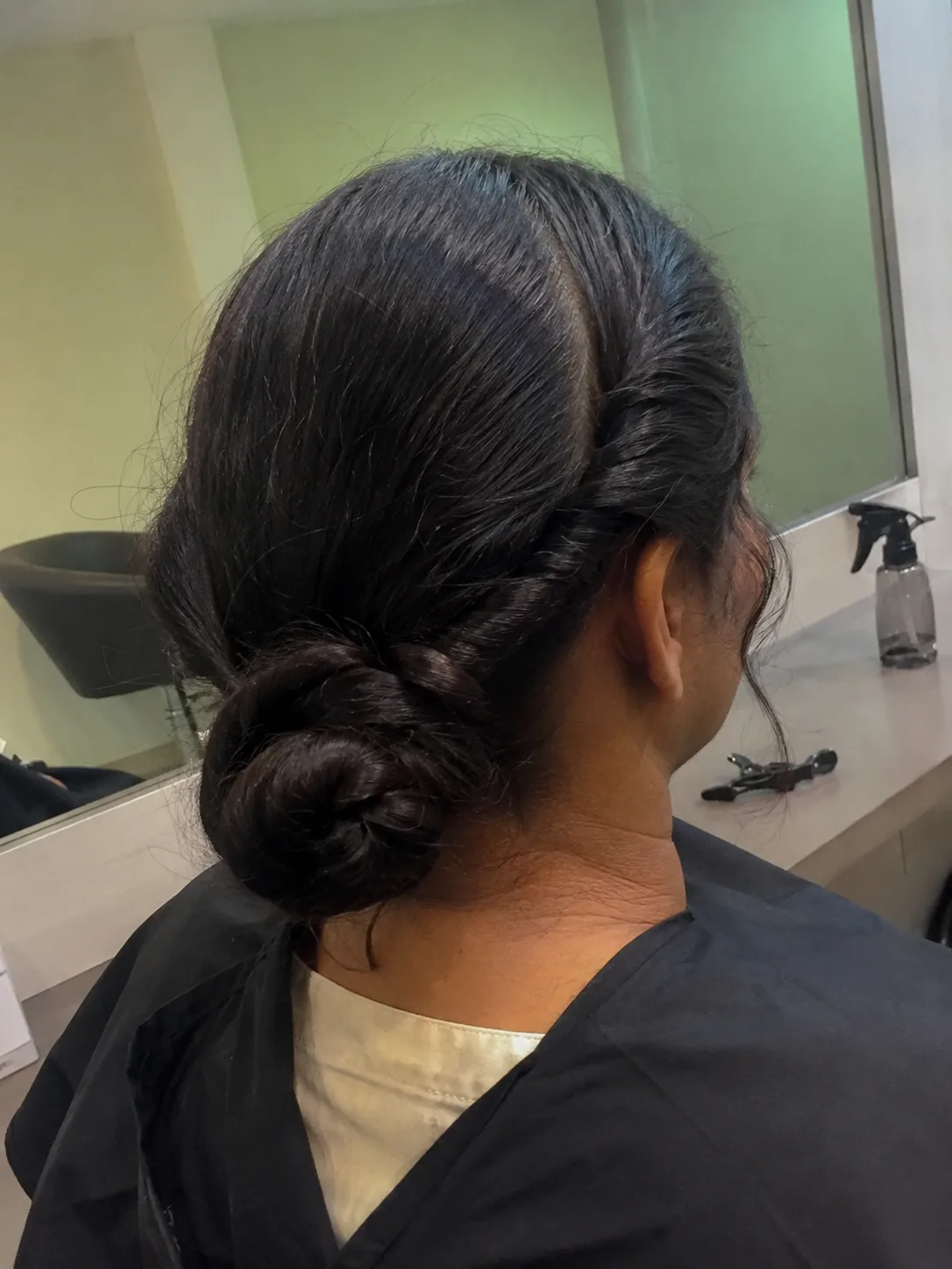 Custom sectioned fishtail braid holding balanced tension across varying hair densities