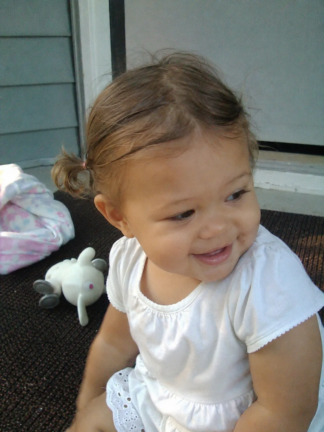 Delicate fine baby hair brushed neatly without the use of harsh or tight accessories