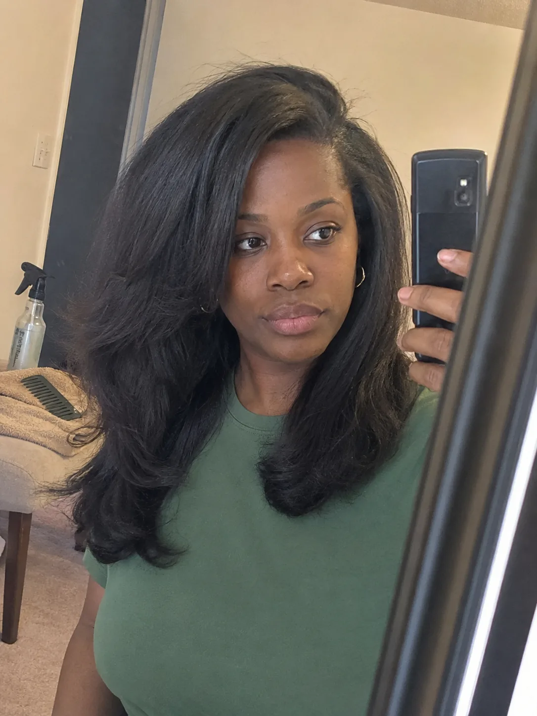 Effortless loosely pinned half-up hairstyle on long dimensional blonde hair for a wedding guest