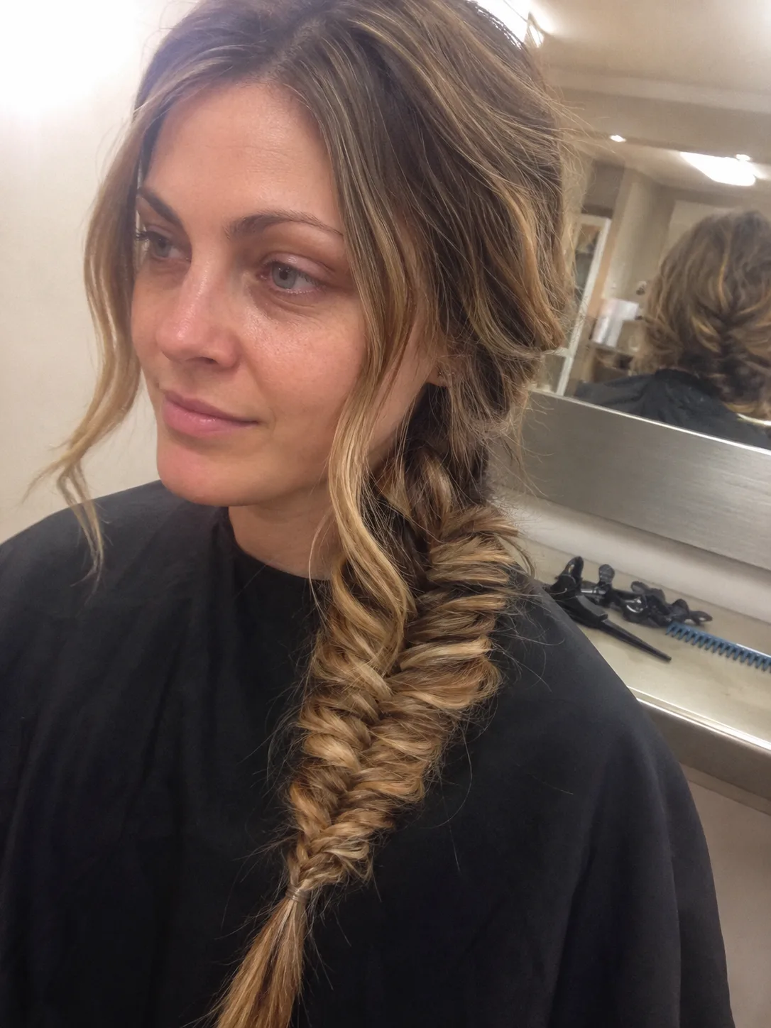Elegant half-up elvish hairstyle with intricate side braids and long tapered face-framing strands.
