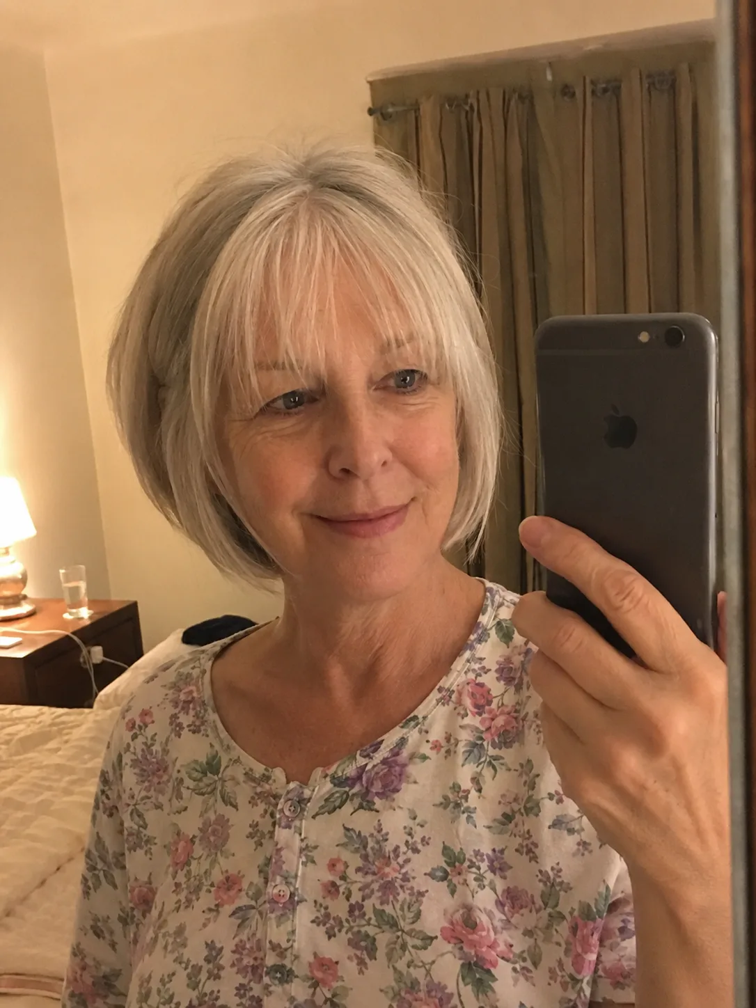Elegant jaw-length classic bob on fine silver hair displaying a clean and well-structured perimeter line