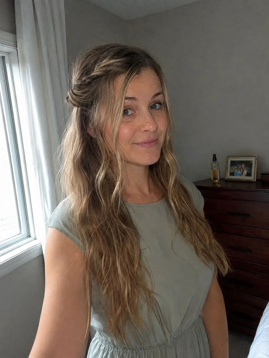 Elegant low bun updo on dark long hair displaying a smooth, photo-ready formal finish.