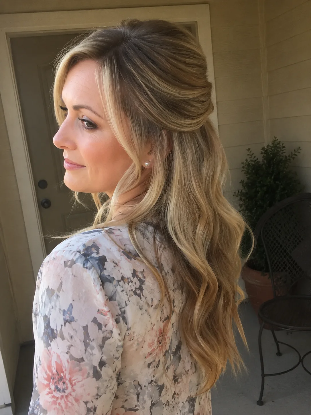 Elegant straight long hair styled in a half-up shape utilizing matte dry texture prep