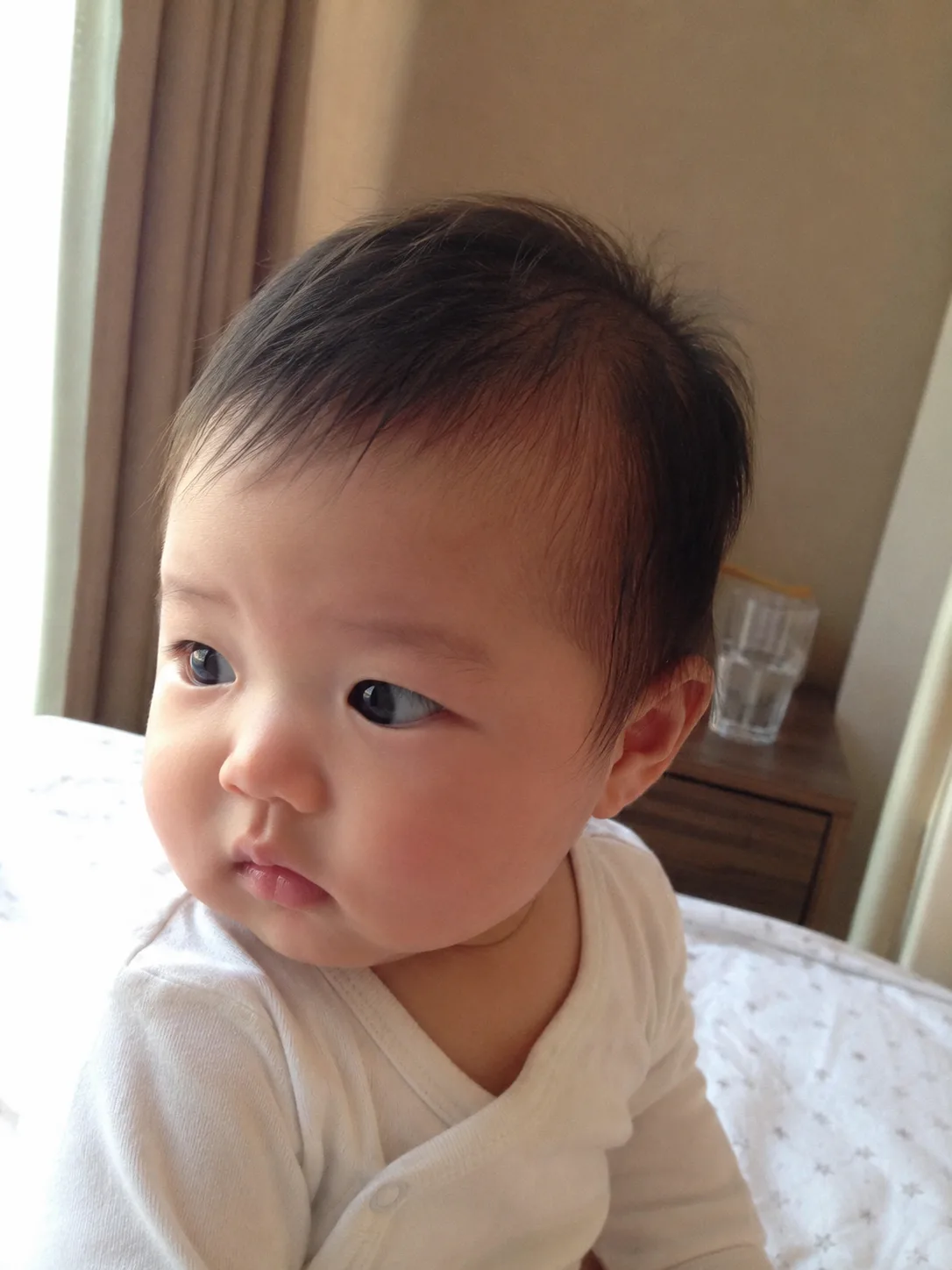 Evenly sectioned braids on a toddler showing natural structural variations