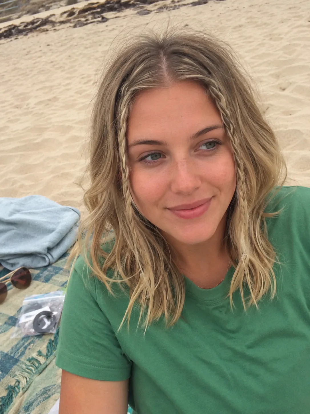 Fine blonde beach hair with mini front braids and loose salt textured waves