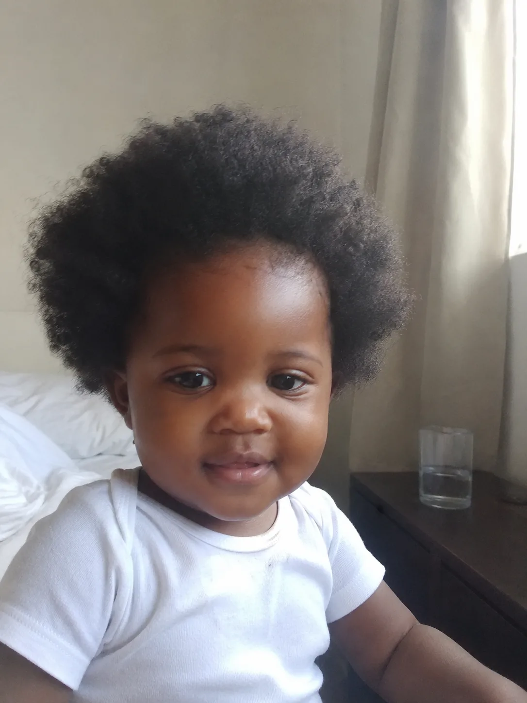 Fine toddler hair damp and free of product film, showcasing natural movement