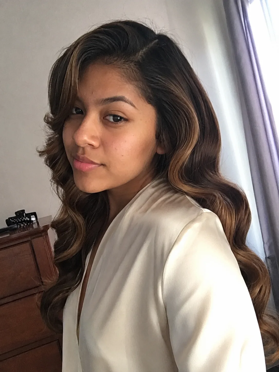Formal curled prom updo for long hair with pinned rolled curls