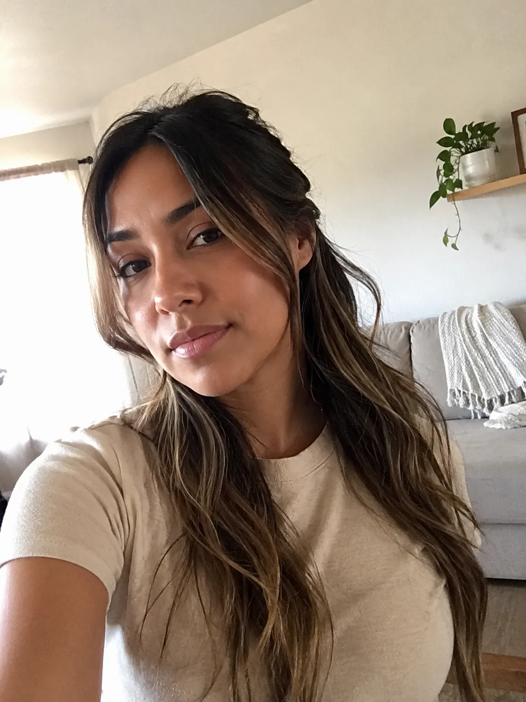 Front-facing selfie illustrating face-framing pieces and density concerns