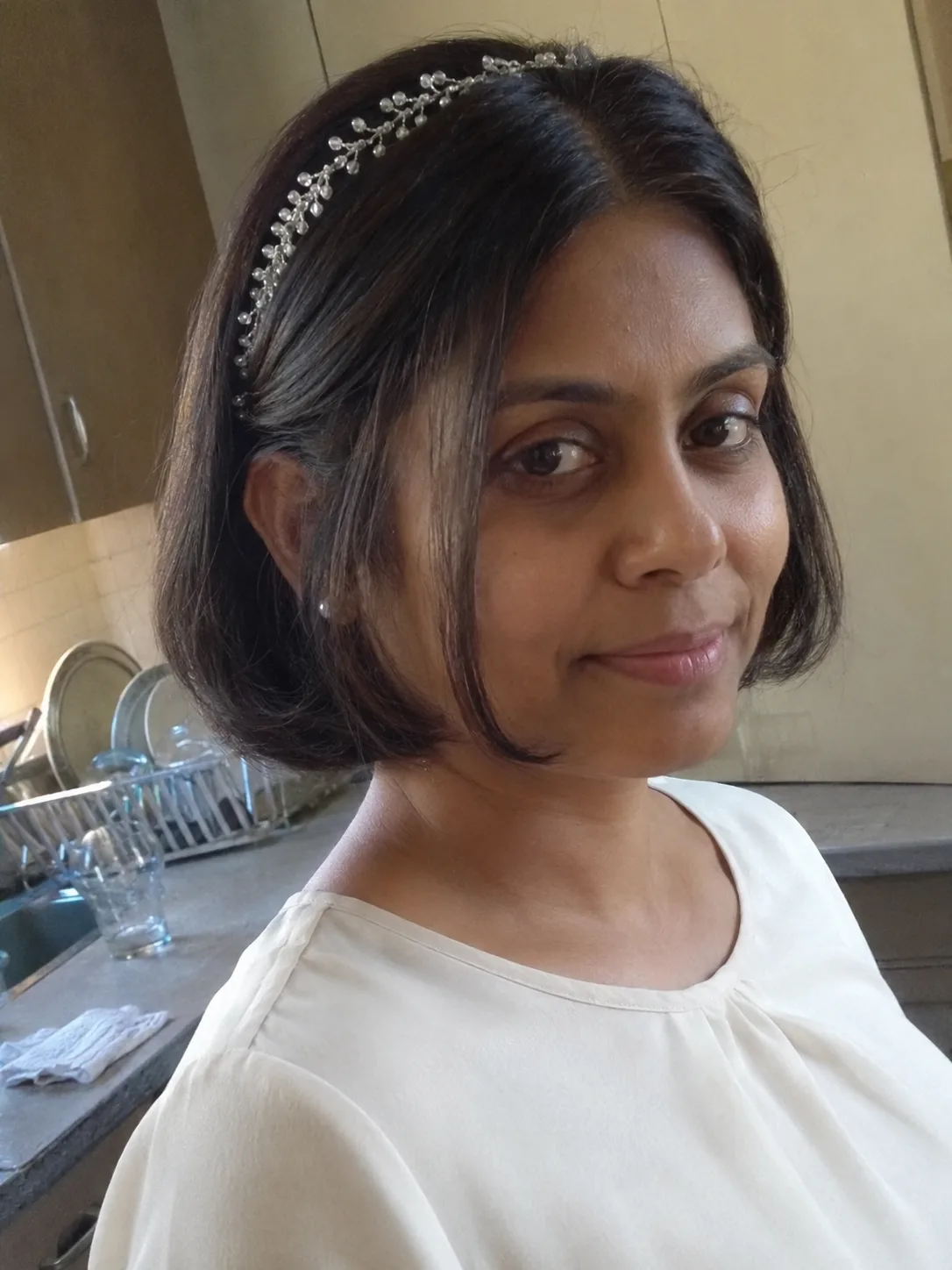 Front-focused shot of structured, uniform curls on a short black hairstyle emphasizing built-in structural hold