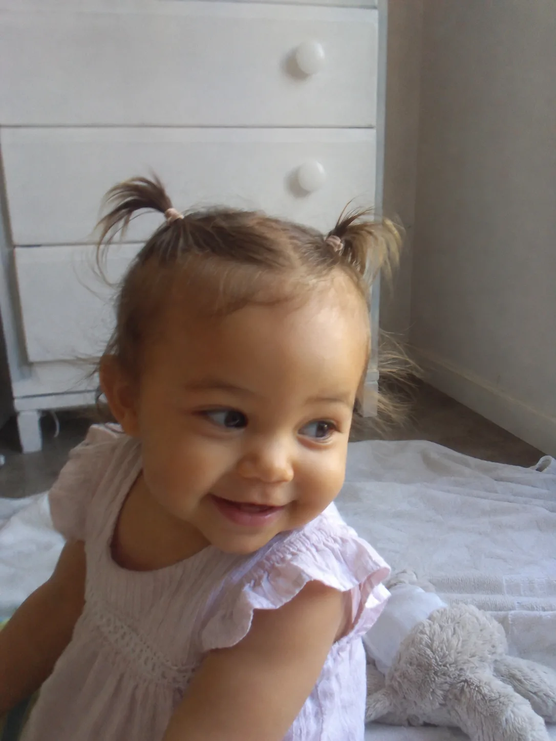 Smooth, low-intervention styling following the child's natural hair growth direction forward