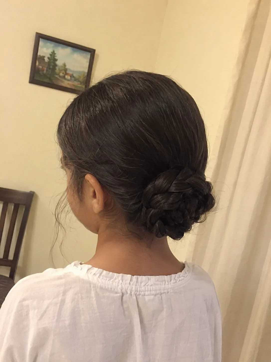 Gentle finger-detangling on a child's dry fine hair before using a brush