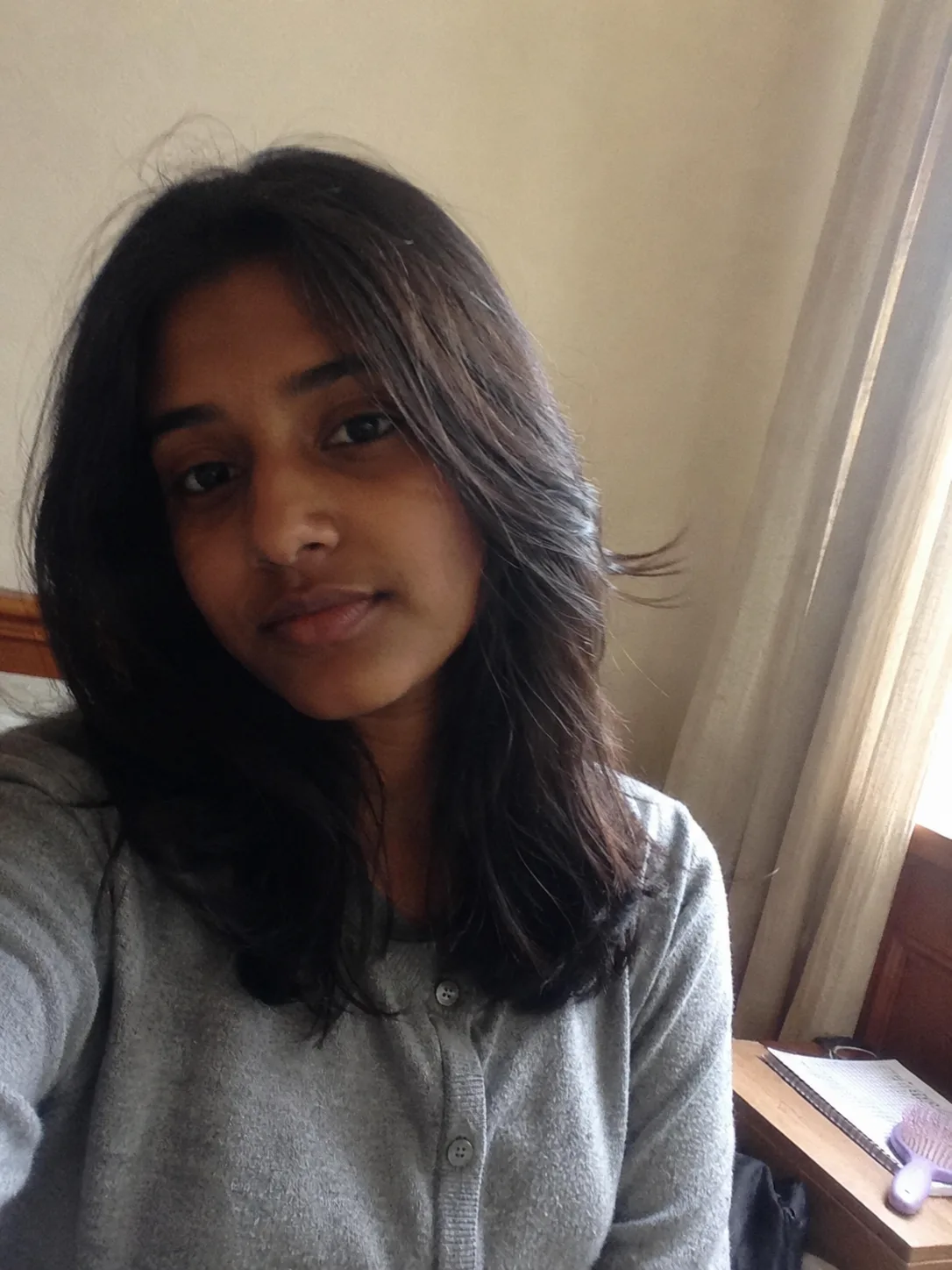 Half up curled hairstyle for teen school hair with soft volume and styled waves