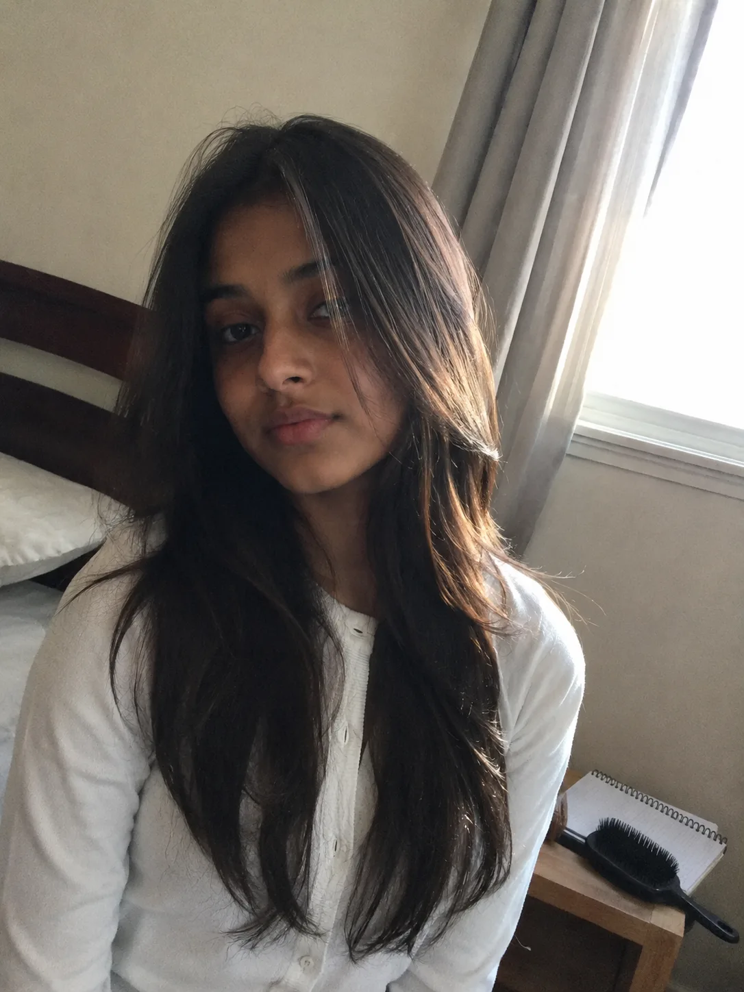 Half-up wavy hairstyle commonly featured in back to school hairstyle roundups