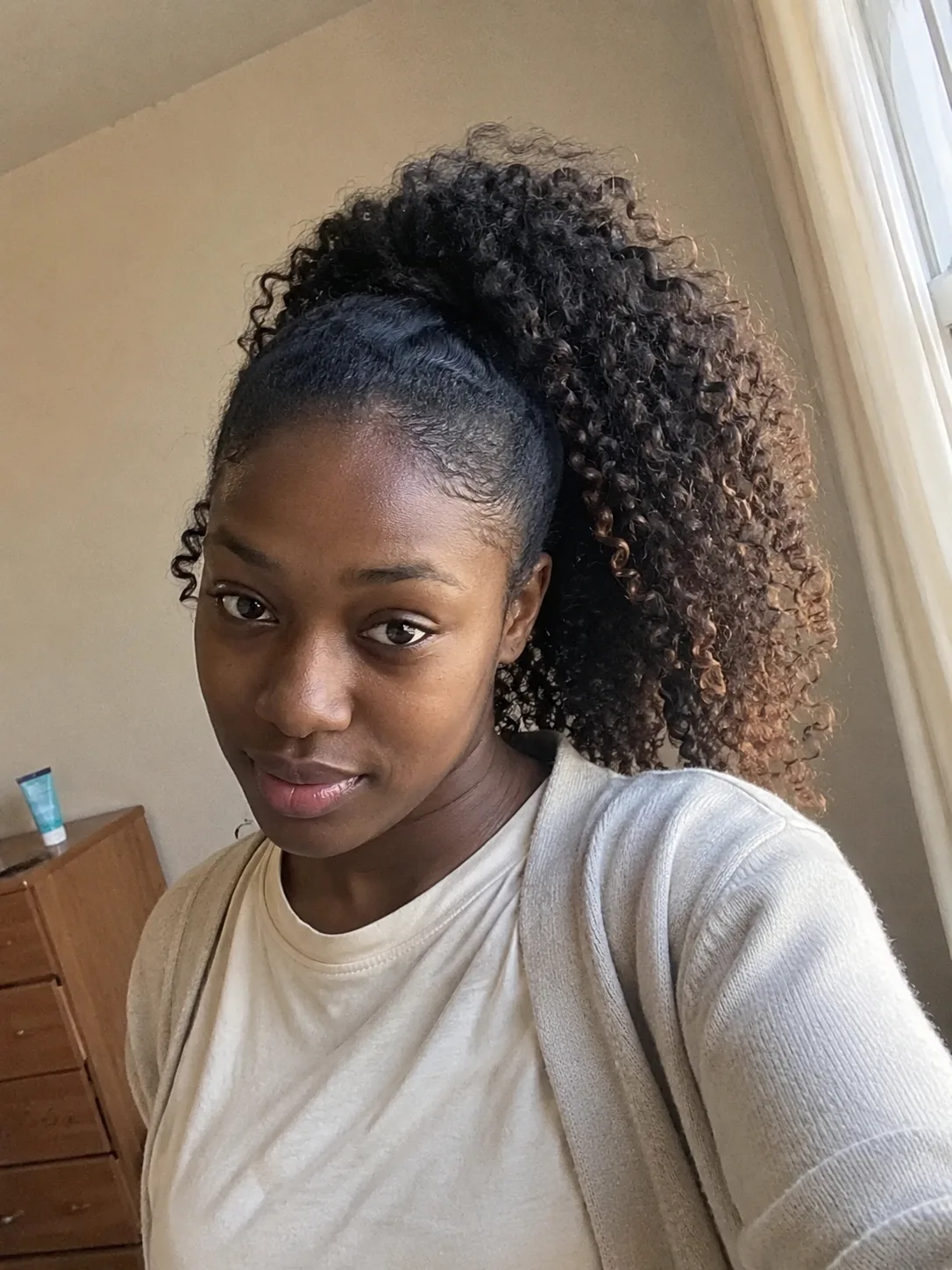 High curly graduation ponytail with defined curls