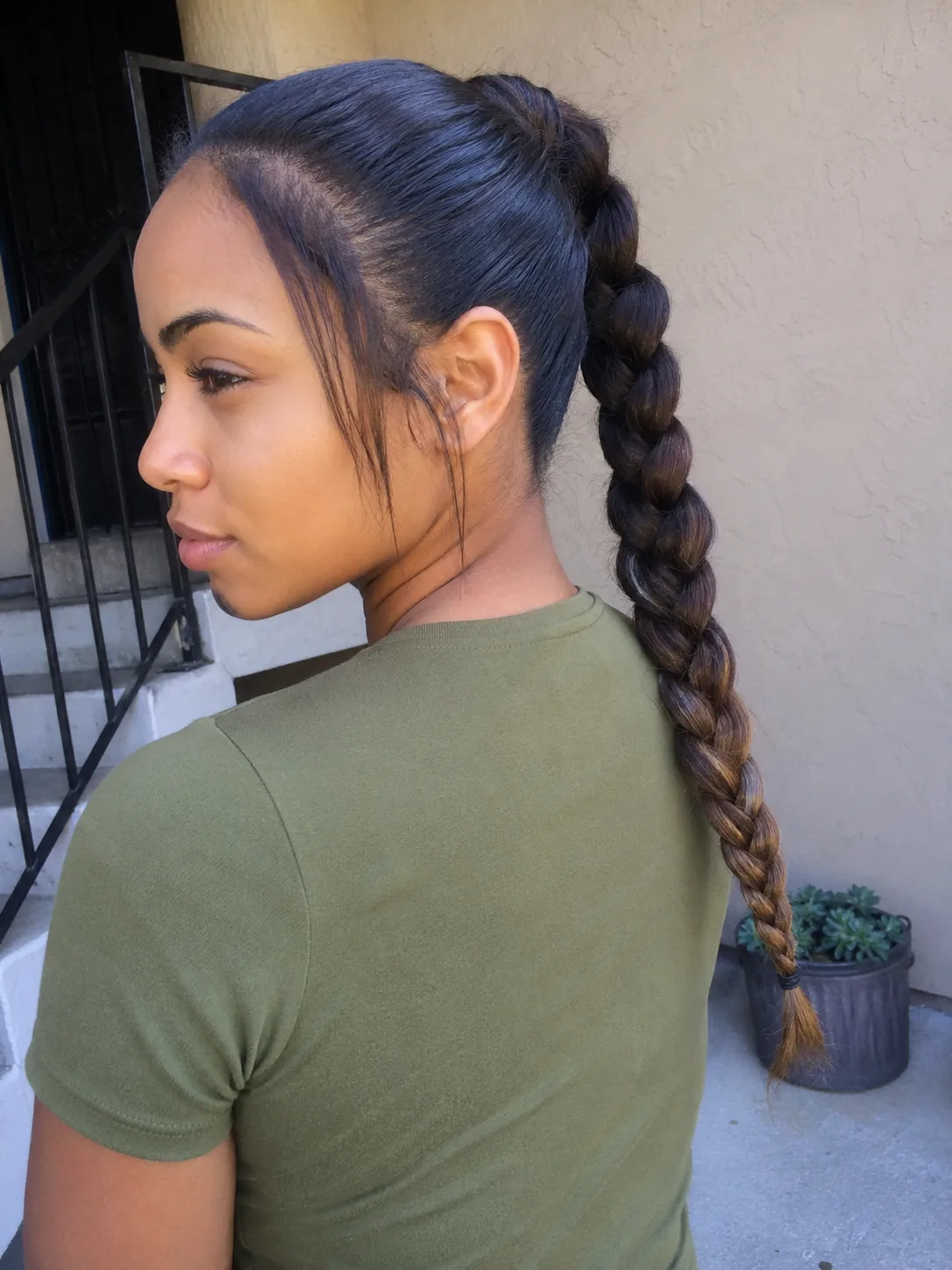 High textured bun hairstyle with loose face framing pieces