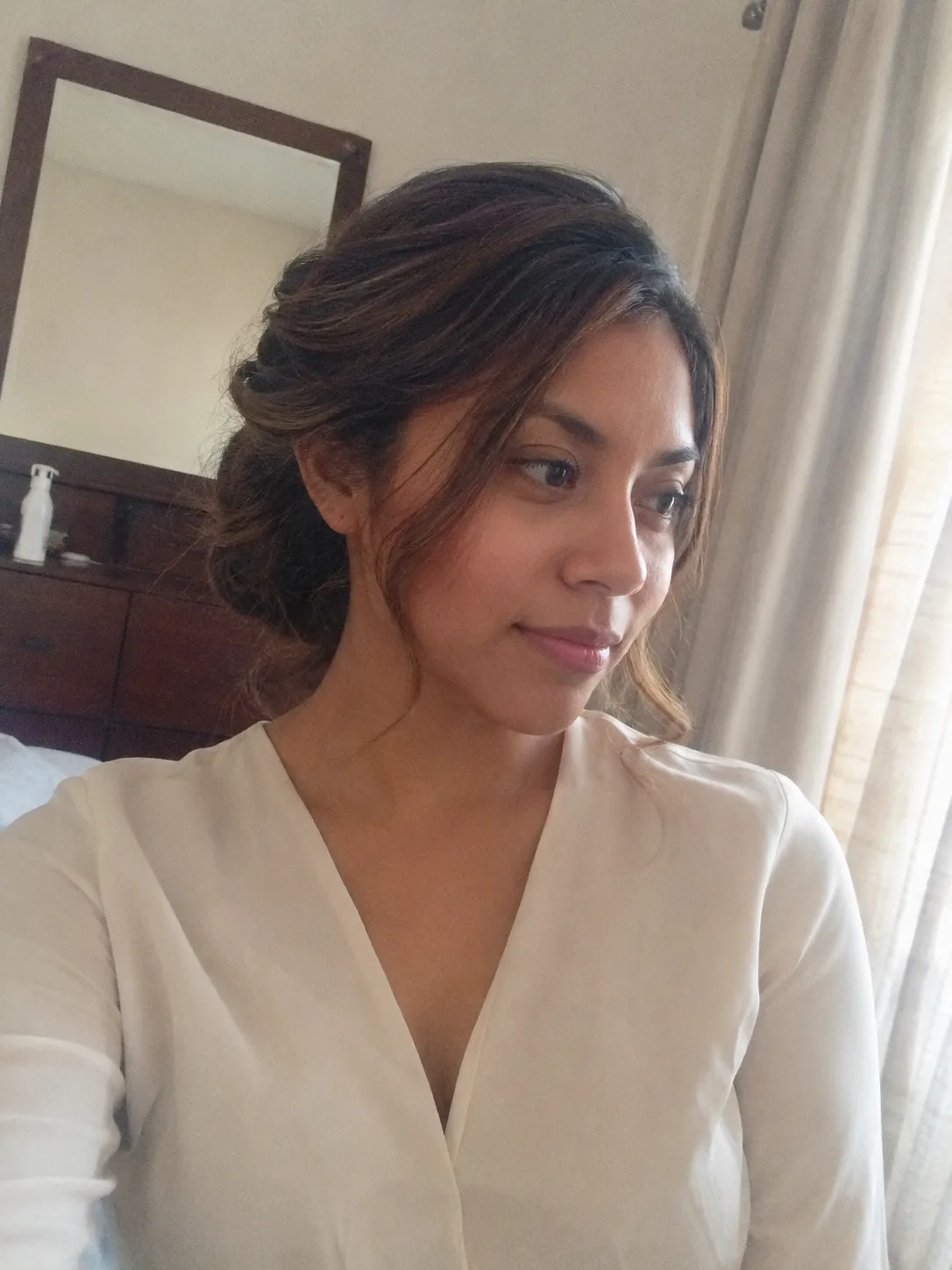 High voluminous curly bridesmaid bun