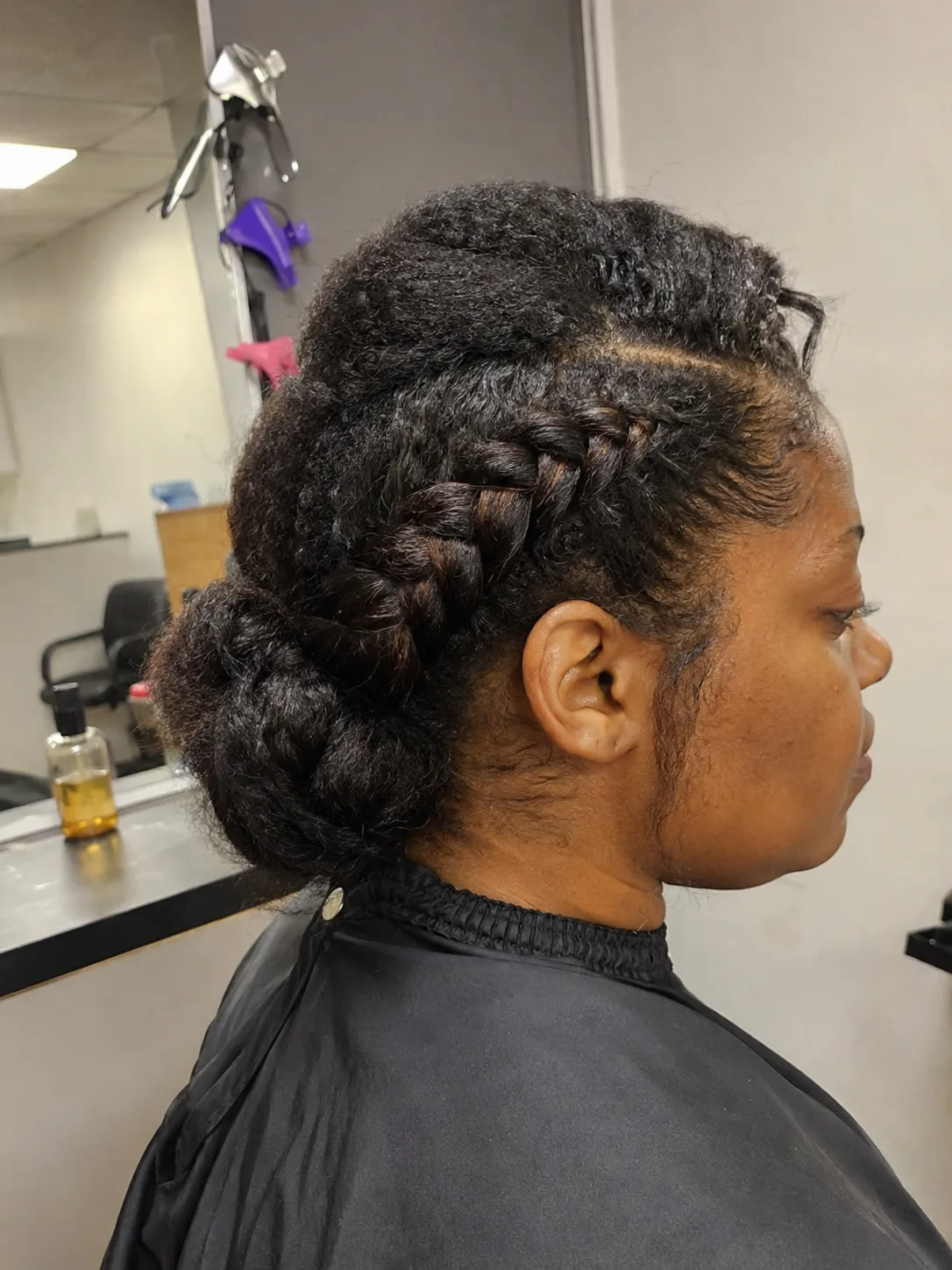Intricate back view of an elvish updo detailing the complex structure that requires careful styling time