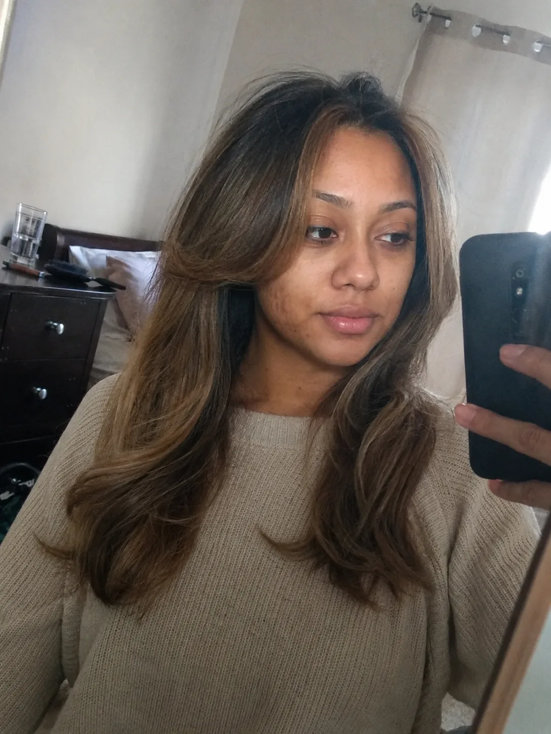 Layered graduation blowout with soft face-framing volume