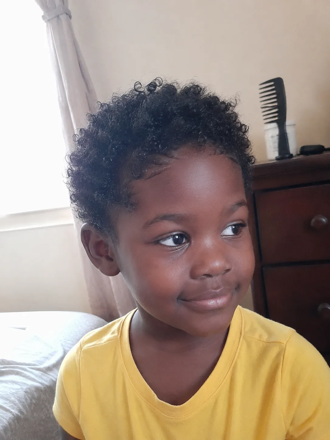 Light cream application strictly at the ends of fine short hair to reduce fluffiness