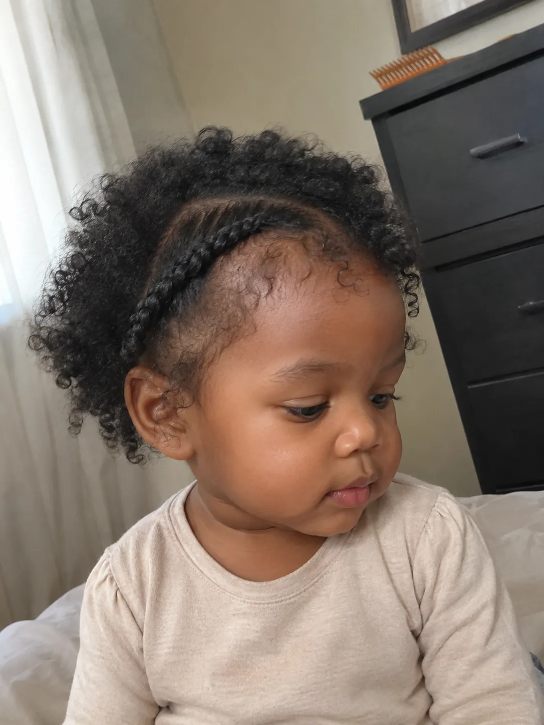 Lightweight ponytail on a toddler showing loose elastic application at the base