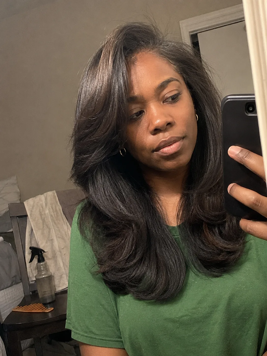 Long hair styled in relaxed wedding guest waves showing uniform hold across the mid-lengths